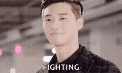 A Close Up Of A Man 'S Face With The Word Fighting On It . GIF