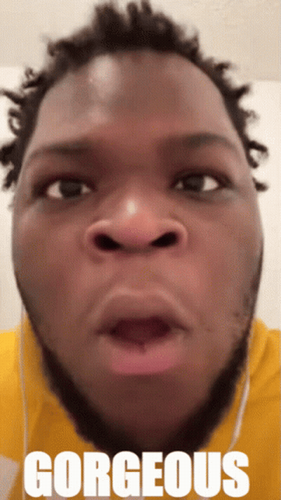 A Close Up Of A Man 'S Face With The Word Gorgeous On The Bottom Right GIF