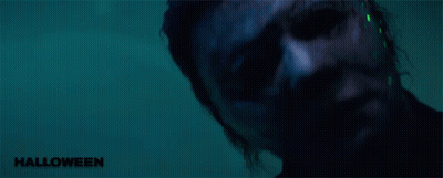 A Close Up Of A Man 'S Face With The Word Halloween On The Bottom Right GIF