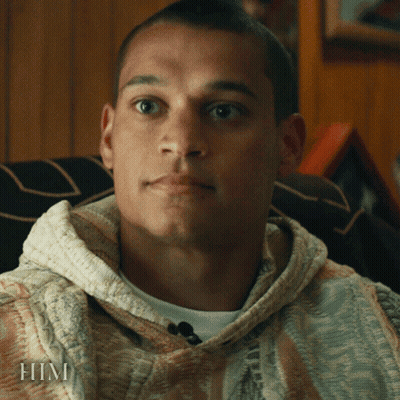 A Close Up Of A Man 'S Face With The Word Him On The Bottom Right GIF