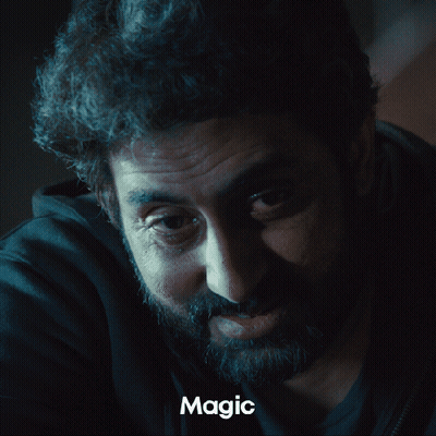 A Close Up Of A Man 'S Face With The Word Magic Underneath GIF