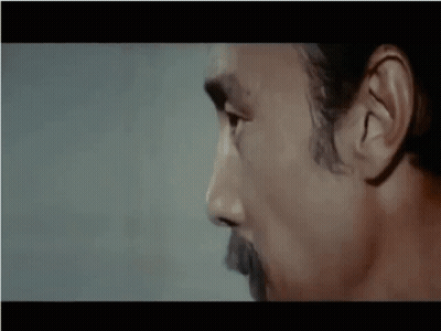 A Close Up Of A Man 'S Face With The Word No In White Letters GIF