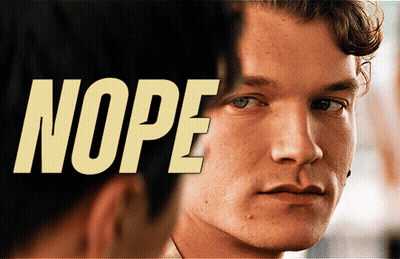 A Close Up Of A Man 'S Face With The Word Nope Behind It GIF