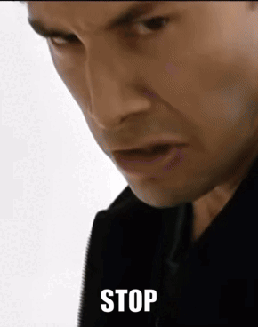 A Close Up Of A Man 'S Face With The Word Stop Written Below It GIF