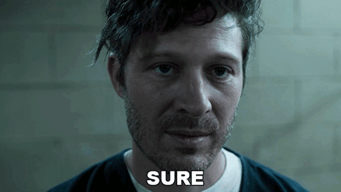 A Close Up Of A Man 'S Face With The Word Sure Visible GIF