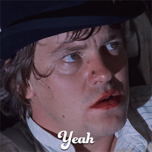 A Close Up Of A Man 'S Face With The Word Yeah Written On The Bottom GIF