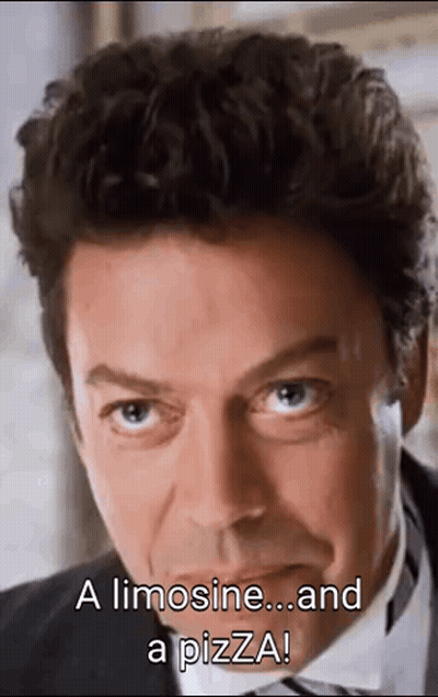A Close Up Of A Man 'S Face With The Words `` A Limousine ... And A Pizza '' Written On It . GIF