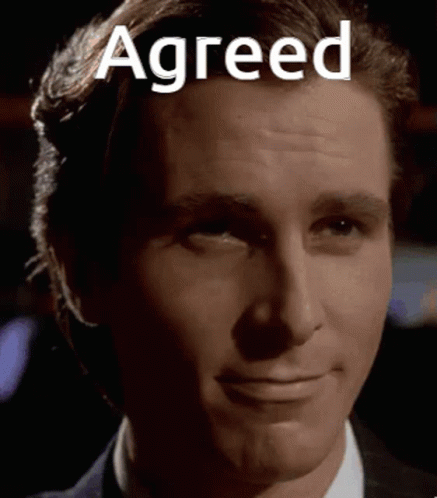 A Close Up Of A Man 'S Face With The Words Agreed Written On It . GIF