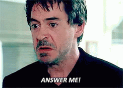 A Close Up Of A Man 'S Face With The Words Answer Me Written On It . GIF