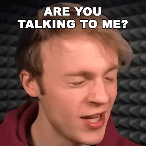A Close Up Of A Man 'S Face With The Words Are You Talking To Me Written Above Him GIF