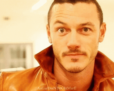 A Close Up Of A Man 'S Face With The Words Asgardian Nightmare Written On The Bottom GIF