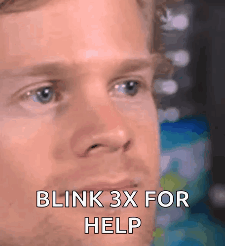 A Close Up Of A Man 'S Face With The Words Blink 3X For Help On It GIF