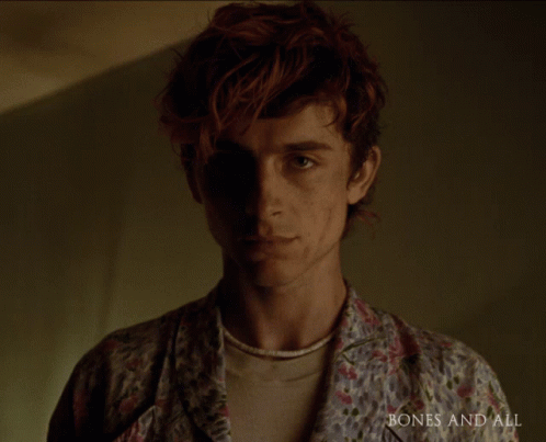 A Close Up Of A Man 'S Face With The Words Bones And All Visible GIF