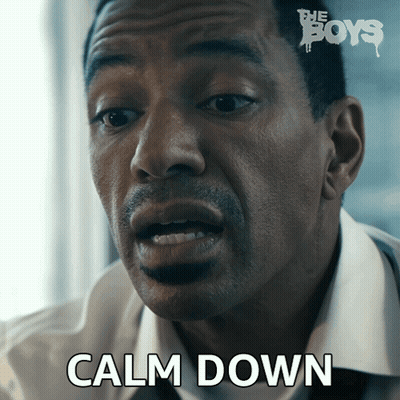 A Close Up Of A Man 'S Face With The Words Calm Down On The Bottom GIF