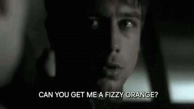 A Close Up Of A Man 'S Face With The Words `` Can You Get Me A Fizzy Orange ? '' Written Below Him . GIF