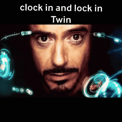 A Close Up Of A Man 'S Face With The Words " Clock In And Lock In Twin " Above Him GIF
