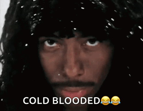 A Close Up Of A Man 'S Face With The Words Cold Blooded GIF