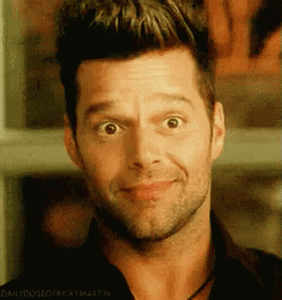 A Close Up Of A Man 'S Face With The Words Daily Dose Of Ricky Martin Below It GIF