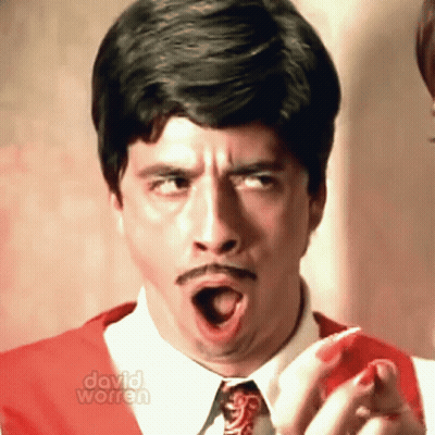 A Close Up Of A Man 'S Face With The Words David Worren On The Bottom Right GIF