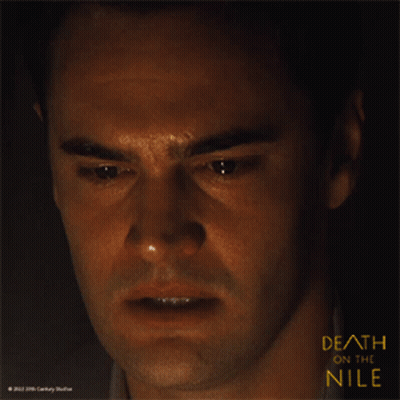 A Close Up Of A Man 'S Face With The Words Death On The Nile Above Him GIF