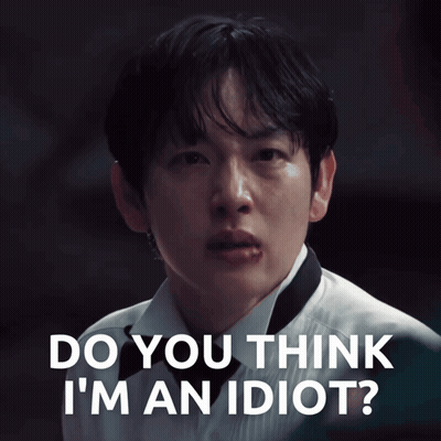 A Close Up Of A Man 'S Face With The Words " Do You Think I 'M An Idiot " Above Him GIF