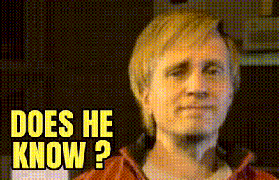 A Close Up Of A Man 'S Face With The Words " Does He Know " Above Him GIF