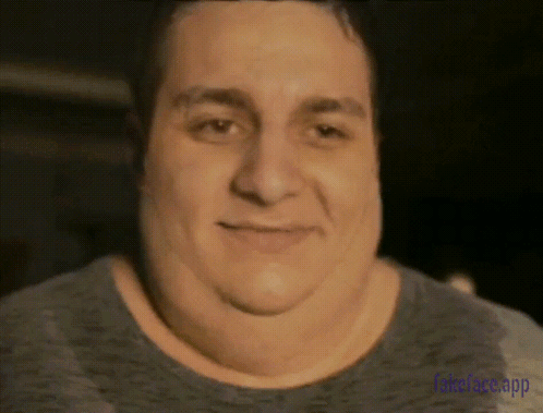 A Close Up Of A Man 'S Face With The Words Fakeface App Visible GIF