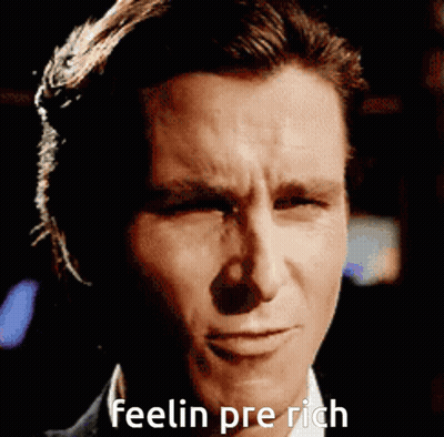 A Close Up Of A Man 'S Face With The Words Feelin Pre Rich Written Below It GIF