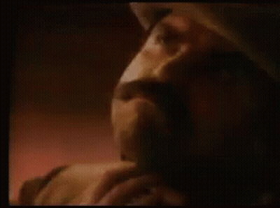 A Close Up Of A Man 'S Face With The Words Get A Rope Written Above Him . GIF