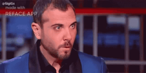 A Close Up Of A Man 'S Face With The Words Gigigx Made With Reface App Visible GIF