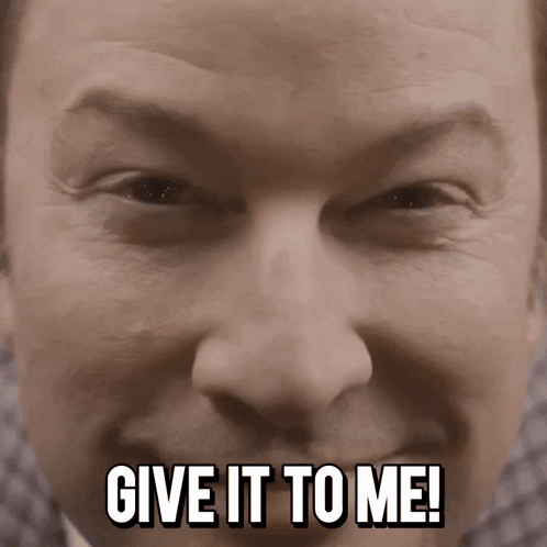 A Close Up Of A Man 'S Face With The Words Give It To Me Below It GIF