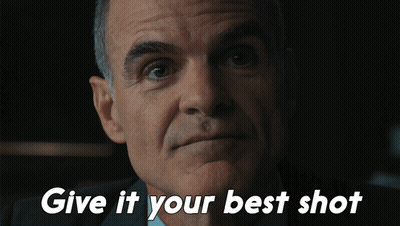 A Close Up Of A Man 'S Face With The Words Give It Your Best Shot Below Him GIF