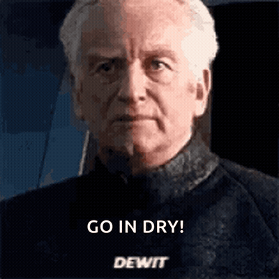 A Close Up Of A Man 'S Face With The Words `` Go In Dry Dewit '' Written On It . GIF