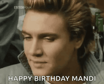 A Close Up Of A Man 'S Face With The Words Happy Birthday Mandi Above Him GIF