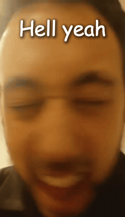 A Close Up Of A Man 'S Face With The Words Hell Yeah Written On It GIF