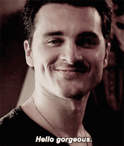 A Close Up Of A Man 'S Face With The Words Hello Gorgeous On The Bottom GIF