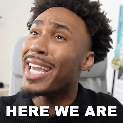A Close Up Of A Man 'S Face With The Words Here We Are Above Him GIF