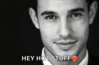 A Close Up Of A Man 'S Face With The Words Hey Hot Stuff Above It GIF