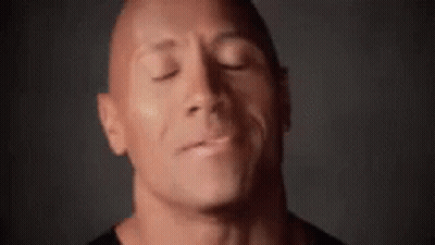 A Close Up Of A Man 'S Face With The Words Hey It 'S Gonna In The Background GIF
