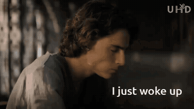 A Close Up Of A Man 'S Face With The Words I Just Woke Up Below Him GIF