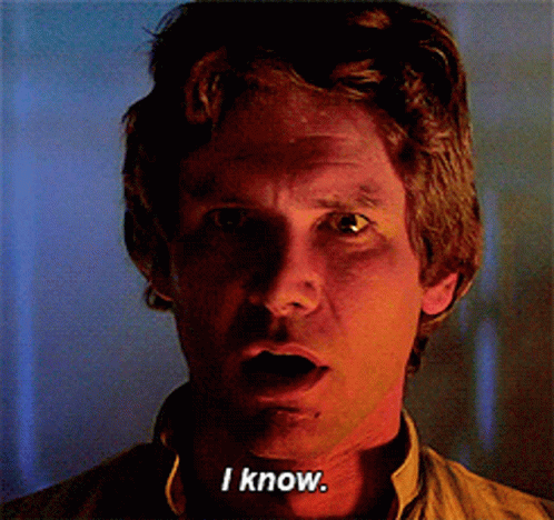 A Close Up Of A Man 'S Face With The Words " I Know " On His Chest GIF