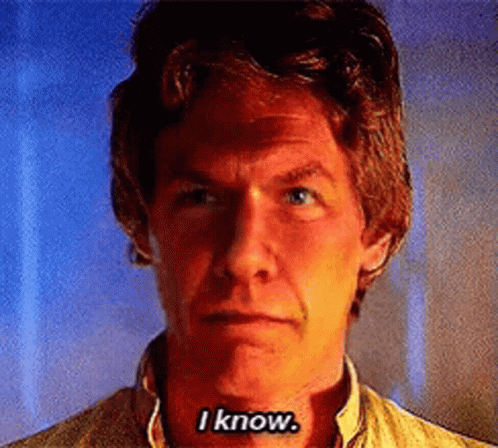 A Close Up Of A Man 'S Face With The Words I Know On His Chest GIF