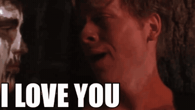 A Close Up Of A Man 'S Face With The Words I Love You Behind Him GIF