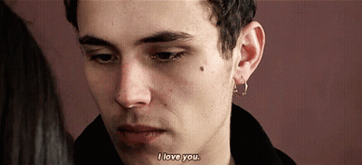 A Close Up Of A Man 'S Face With The Words " I Love You " On The Bottom GIF