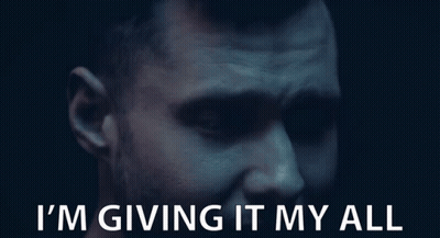 A Close Up Of A Man 'S Face With The Words I 'M Giving It My All Below Him GIF