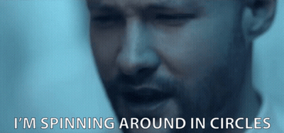 A Close Up Of A Man 'S Face With The Words I 'M Spinning Around In Circles Below It GIF