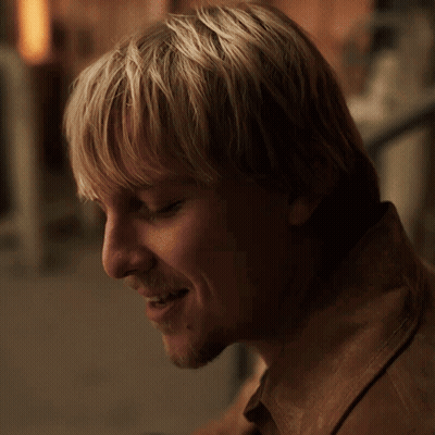A Close Up Of A Man 'S Face With The Words " I 'M Trying " Above Him GIF