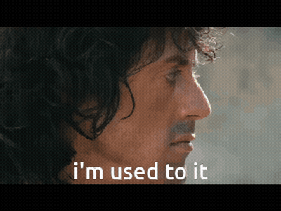 A Close Up Of A Man 'S Face With The Words " I 'M Used To It " Below Him GIF