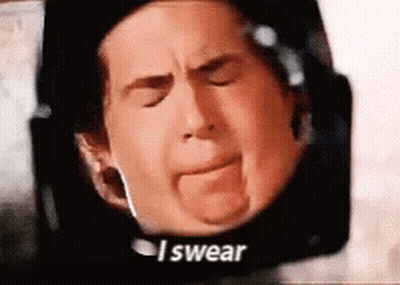 A Close Up Of A Man 'S Face With The Words `` I Swear '' Written On The Bottom . GIF