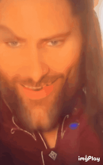 A Close Up Of A Man 'S Face With The Words Imgplay At The Bottom Right GIF